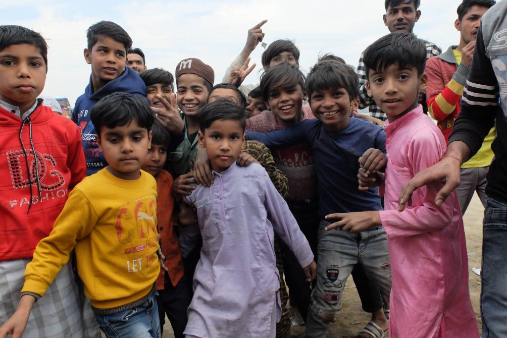 young boys at an e waste dump in India